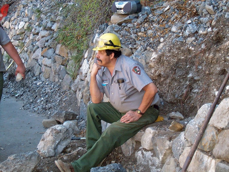 Don "Dino" Robinson performing his rock wall repair ritual.